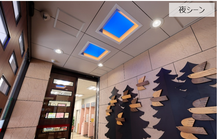 北海道信用金庫 山鼻中央支店様の風除室に設置された「青空照明」（夜）
